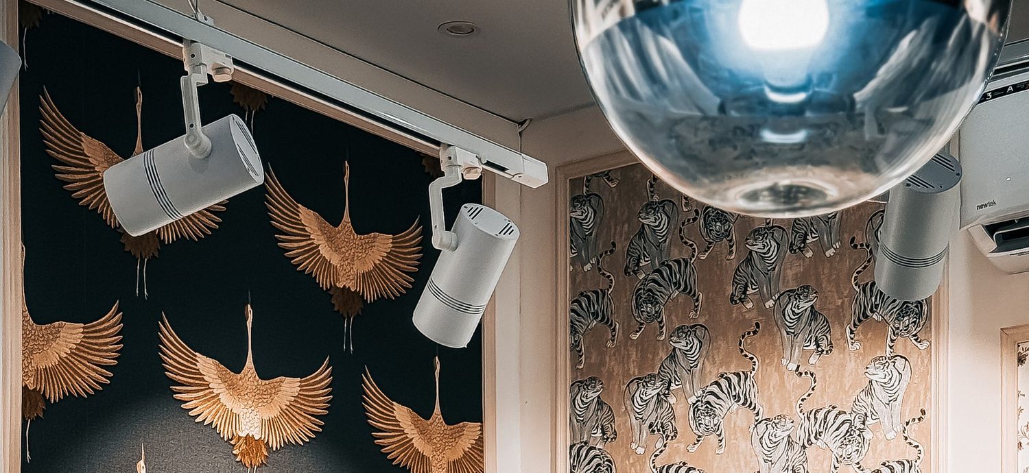 Wallpaper and fabric displays on the walls of an interiors studio